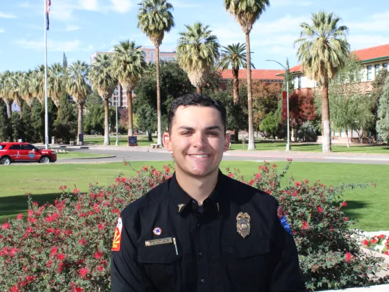 James in front of campus